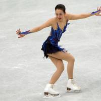 National icon: Mao Asada performs during the women\'s free skate on Saturday at the World Figure Skating Championships in Saitama. Mao earned her third world title. | AFP-JIJI
