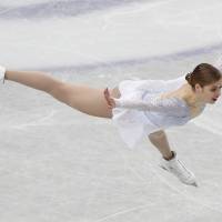 Full flight: Italy\'s Carolina Kostner jumps during her short program at the world championships on Thursday. Kostner is in second place. | REUTERS