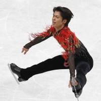 In-air artistry: Silver medalist Tatsuki Machida skates during the men\'s free program on Friday at Saitama Super Arena. | REUTERS