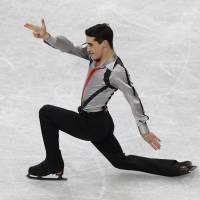 Here to contend: Spain\'s Javier Fernandez earns the bronze medal in the men\'s competition at the World Figure Skating Championships on Friday. | REUTERS