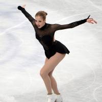 Respectable showing: Italy\'s Carolina Kostner places third in the women\'s competition at the world championships. | AFP-JIJI