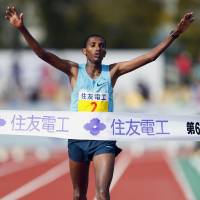 Ahead of the pack: Ethiopia\'s Bazu Worku crosses the line at Ojiyama Stadium to win the Lake Biwa Marathon on Sunday. | KYODO