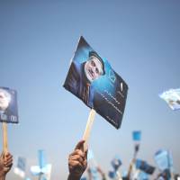 In the run-up to Afghanistan\'s closely watched elections scheduled for April 5, supporters hold up posters of presidential candidate Abdullah Abdullah during a rally organized in the northern province of Parwan on Thursday. | REUTERS