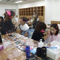 Artful fun: Makeup artists paint children\'s faces at the Akashi Lifelong Learning Center during Akashi Artful Week. | &#169; Warner Bros. Entertainment. All rights reserved.