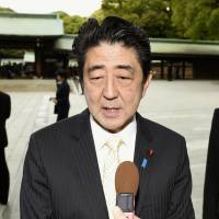 Prime minister Shinzo Abe speaks to the press Monday while paying a visit to Meiji Shrine with his Prime Minister Shinzo Abe visited Meiji Shrine in Tokyo on Monday morning, together with his wife, Akie.  | KYODO