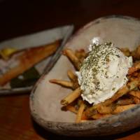 Eat more chips: Fries are not the only dish at Gohanya Isshin, but they certainly are to die for, coated with pesto and topped with cream cheese. Gohanya Isshin: a diverse menu topped by fries that wax poetic