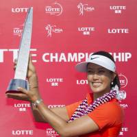 Drought ends: Michelle Wie shows off her trophy after winning the LPGA Lotte Championship in Kapolei, Hawaii, on Saturday. Wie carded a final-round 67 and won by two strokes. Wie wins in Hawaii for first victory in four years