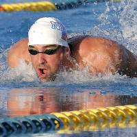 Beginning again: Michael Phelps competes in the final of the 100-meter butterfly on Thursday at the Arena Grand Prix in Mesa, Arizona. Phelps finished second in the race. | AP