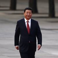 Chinese President Xi Jinping prepares to welcome Serbian President Tomislav Nikolic at a state ceremony in Beijing last August. By banishing corrupt senior officials, Xi is maneuvering close aides and reform-minded bureaucrats into key government and military positions. | REUTERS