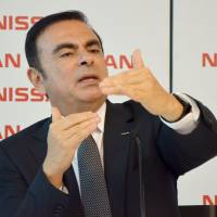 Nissan Motor Co. Chief Executive Officer Carlos Ghosn gestures during a news conference in Rio de Janeiro on Tuesday. | KYODO
