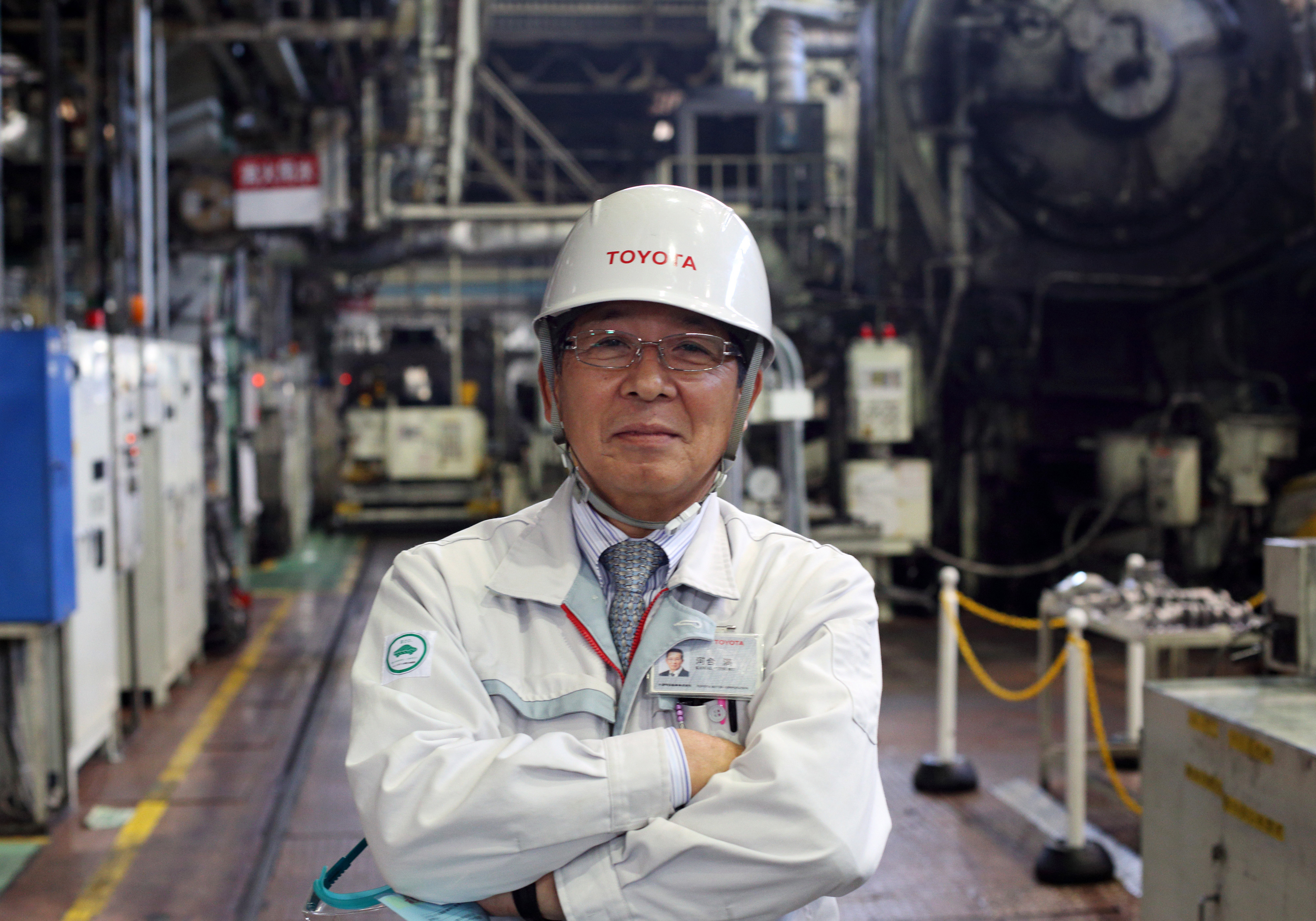 Mitsuru Kawai, senior technical executive at Toyota Motor Corp., poses in the forging department at one of the automaker's plants in Toyota, Aichi Prefecture, in February. | BLOOMBERG