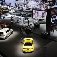 Cars from Toyota\'s Scion brand (foreground) are shown at the New York International Auto Show on Thursday. | AP