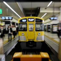 A Seibu Railway train departs from a station in Tokyo on Wednesday. Japanese railway and hotel giant Seibu Holdings Inc. returned to the Tokyo stock market the same day, a decade after it was delisted following a major accounting scandal. Delisted Seibu Holdings back on TSE