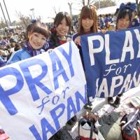 Go team: Female Japanese soccer fans at a charity match in March 2011. | REUTERS