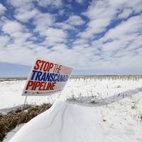 A sign opposing construction of the Keystone XL oil pipeline is seen in a field near Bradshaw, Nebraska, in March 2013. U.S. further delays making final decision on Keystone XL pipeline