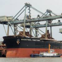 The Baosteel Emotion, a ship owned by Japanese shipping firm Mitsui O.S.K. Lines Ltd., is moored at a port in Zhejiang province on Tuesday. | KYODO
