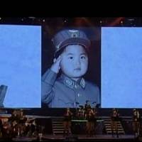 An image from video broadcast by North Korean state-run television Monday shows still photos from the childhood of the country\'s leader, Kim Jong Un, after a concert in Pyongyang. | REUTERS