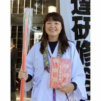 Choi Sang-hee, a South Korean and the first non-Japanese female guide of the 88-temple pilgrimage on Shikoku, poses for a photo in December. | KYODO