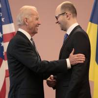U.S. Vice President Joe Biden (left) talks with Ukrainian Prime Minister Arseniy Yatsenyuk during a meeting in Kiev on Tuesday. | AP