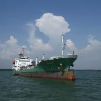 An oil tanker that was raided by armed pirates sails into Port Klang, off Kuala Lumpur, on Wednesday. | REUTERS