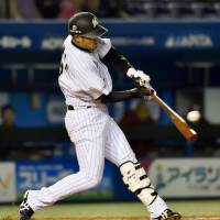 Big blast: The Marines\' Toshiaki Imae belts a long home run in the second inning against the Eagles on Friday at QVC Marine Field. | CHIBA LOTTE DEFEATED TOHOKU RAKUTEN 4-3.