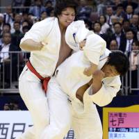 Back on top: Daiki Kamikawa (right) throws Ryu Shichinohe at the national invitational weight-class judo championships in Fukuoka on Saturday. | KYODO