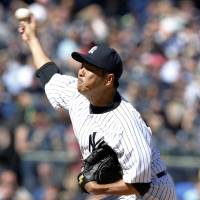 Not his best stuff: Yankees right-hander Hiroki Kuroda, who allowed six hits and four earned runs over 6 1/3 innings, earned a victory over the Red Sox on Saturday. New York beat Boston 7-4. | KYODO
