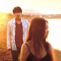 An escape: The turbulent relationship between Chinatsu (Chizuru Ikewaki) and Tatsuo (Go Ayano) is consummated after a wander along an empty beach near Hakodate, a port town in Hokkaido. | &#169; 2014 SATO YASUSHI / \"SOKO NOMI NITE HIKARI KAGAYAKU\" SEISAKU IINKAI