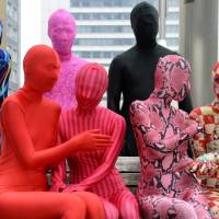 Members of the Tokyo Zentai Club meet at a park in Tokyo. Like just any group, they meet up every other month to hold barbecues or parties. Unlike any other group, they are covered head-to-toe in skintight Lycra. | AFP-JIJI