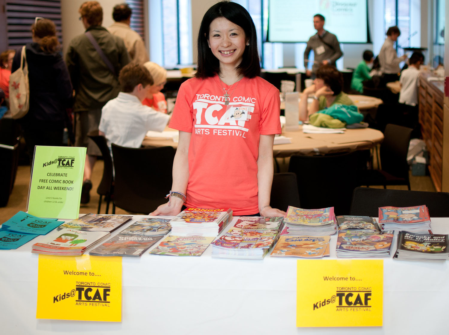 Flipping through: A volunteer staffs an area for children at last year's Toronto Comic Arts Festival. | PAUL HILLIER