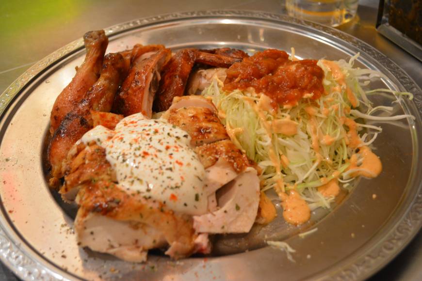 Que Rico The standout dish: Que Rico's rotisserie chicken is messy but delicious. | J.J. O'DONOGHUE