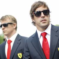 Solemn occasion: F1 drivers Fernando Alonso (right) of Spain and Kimi Raikkonen of Finland arrive Thursday for a memorial service for Ayrton Senna at Imola Racetrack in northern Italy. | REUTERS