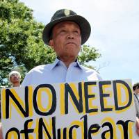 Hard sell: A protester attends an anti-nuclear rally in Tokyo in July 2012. | BLOOMBERG