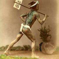 A tattooed post-runner delivers mail in Japan circa 1896. | ROB OECHSLE COLLECTION