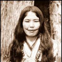 An Ainu woman with a face tattoo poses for a photo in Hokkaido circa 1910. | ROB OECHSLE COLLECTION