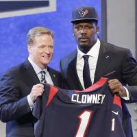 Great expectations: Defensive end Jadeveon Clowney poses for photographers with NFL commissioner Roger Goodell after being selected as the No. 1 pick in the NFL Draft by the Houston Texans on Thursday night. | AP