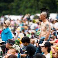 Last of the Mohicans: A man watches a performance on the Green Stage at Fuji Rock Festival 2013. | JAMES HADFIELD
