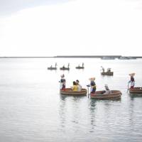 Picture perfect: Tourists ride in tub-turned boats off Sado Island during Earth Celebration. | COURTESY OF EARTH CELEBRATION