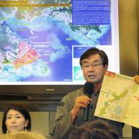 Susumu Inamine, mayor of Nago, Okinawa Prefecture, addresses a gathering in New York on Saturday. | KYODO