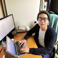 University student Yamato Aoki, who created a forum where high school students can communicate directly with Diet lawmakers, poses in his room in Bunkyo Ward, Tokyo, on April 28. | YOSHIAKI MIURA