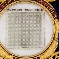 A 1.5 sq.-inch (3.8 sq.-cm) microfilm Bible that flew around the moon is seen in a picture from Heritage Auctions. | REUTERS