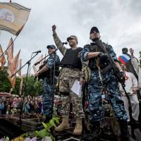 Pro-Russian activists rally in eastern Ukraine\'s Luhansk region Monday, following a referendum that asked residents if they supported independence from the country. The United States and other nations condemned the poll as unconstitutional, but Moscow said it would \"respect\" the outcome of the vote. | AP