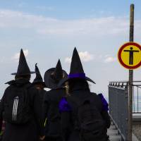 Women dressed as a witches walk at the summit of Brocken mountain in the Harz region to celebrate the Walpurgisnacht pagan festival on Wednesday. | REUTERS