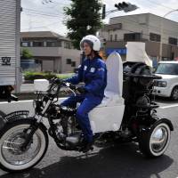 A rider demonstrates Japanese toilet goods-maker Toto’s eco-friendly Toilet Bike Neo motorcycle, which uses bio-gas from livestock or waste water discharges, as part of the firm’s green campaign in Omiya, western Tokyo, in August 2012. 1 billion practitioners of 'open defecation' horrify U.N.