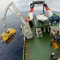 The Zeus vehicle is launched from the Odyssey Explorer to probe a shipwreck in this photo released Tuesday. | REUTERS