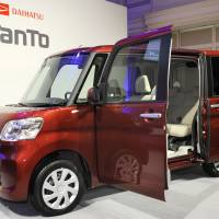 Daihatsu Motor Co. unveils an updated Daihatsu Tanto minicar in Tokyo in October. | KYODO