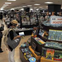 A shopper explores the remodeled foreign books section at Kinokuniya bookstore\'s branch in Takashimaya Times Square near Shinjuku Station on Thursday. | SATOKO KAWASAKI