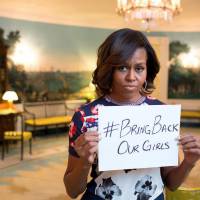 Michelle Obama holds up a placard expressing solidarity and sympathy for the kidnapped Nigerian girls and their families in a photo sent out Thursday on the U.S. first lady’s official Twitter account. U.S. first lady uses bully pulpit to push concerns about girls