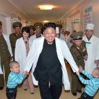 North Korean leader Kim Jong Un is seen on a recent tour of an orphanage, at Taesongsan General Hospital in Pyongyang. | AFP-JIJI