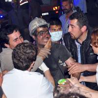A rescued miner surrounded by relatives, medics and other miners in Soma, western Turkey, on May 13, 2014. An underground explosion and fire left dozens of miners dead and hundreds trapped, early reports said, citing officials. | REUTERS